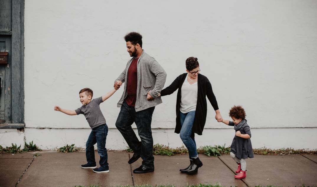 A family walks to their favorite spot in the Copper District